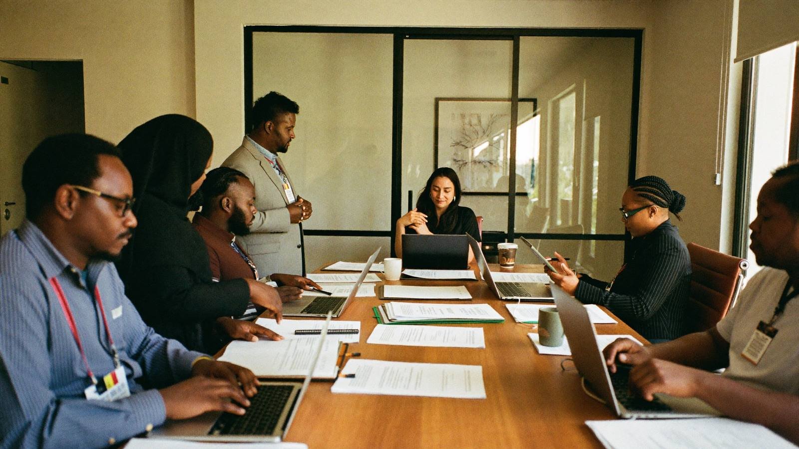 The Omariman team in a standing meeting at the Nairobi office