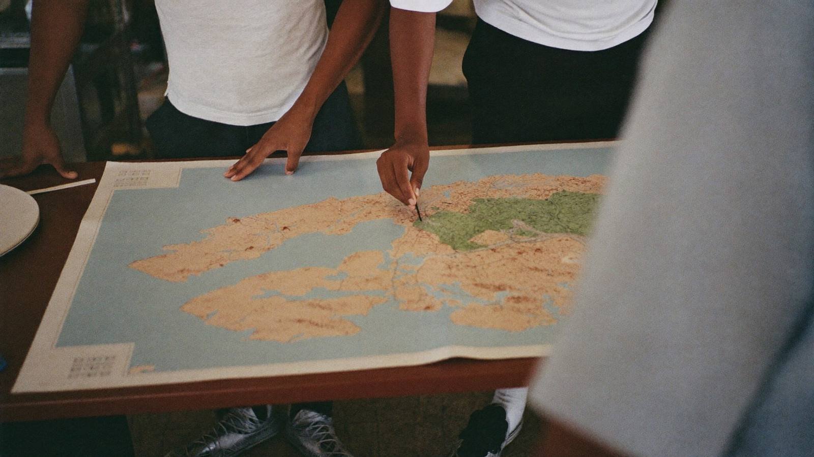 Planners around a large printed map in a government office