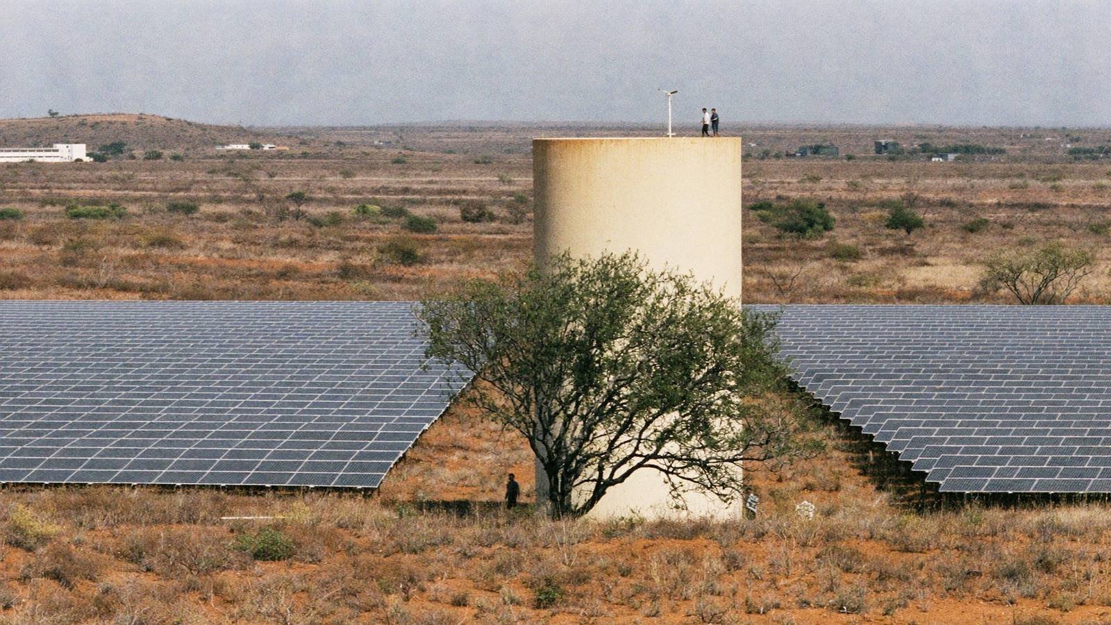 Wide view of a solar array and water tower in Wajir