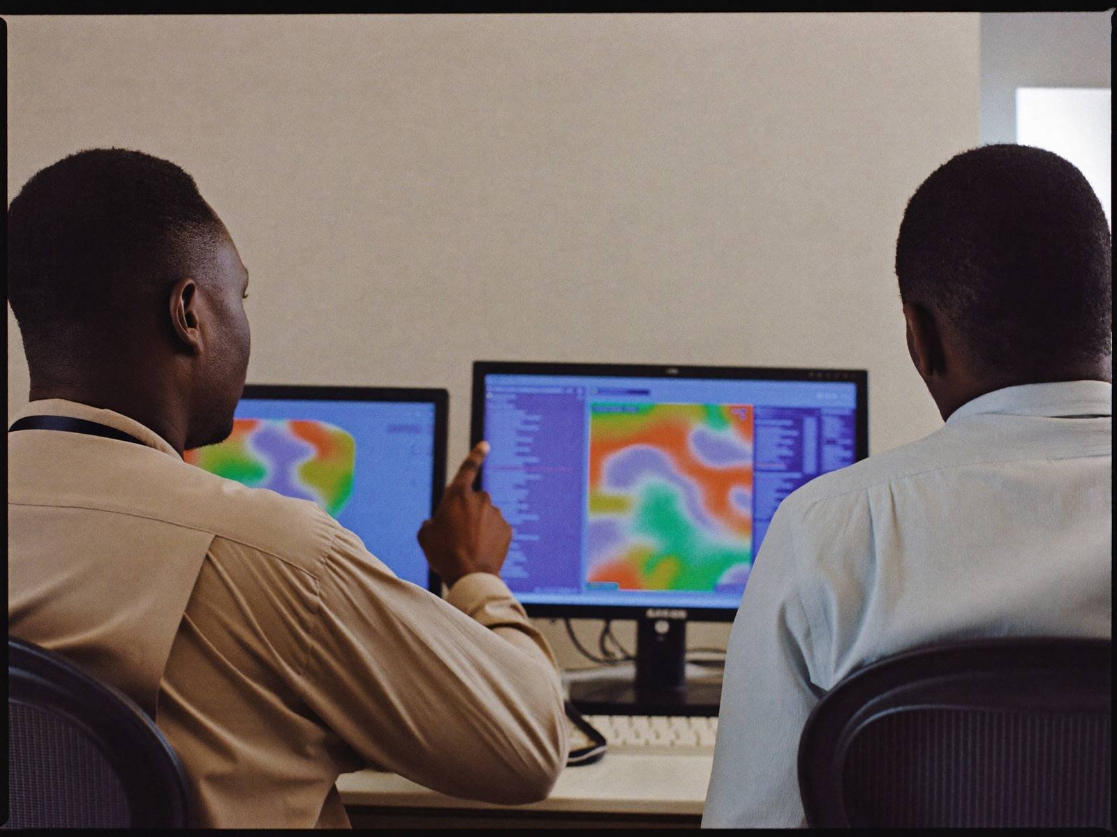 Developers working on a map dashboard in a Nairobi office